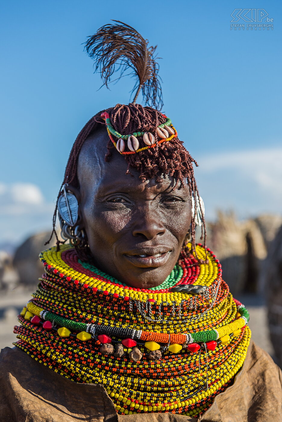 Lake Turkana - Turkana woman The Turkana is a large tribe that still lives quite traditionally. They are mainly semi-nomadic pastoralists. Women often have a Mohawk hairstyle and they wear many colorful necklaces and bracelets of beads. Married women are identified by the aluminium earrings in the shape of a leaf. Sometimes they even wear clothes of goat and cow leather.  Stefan Cruysberghs